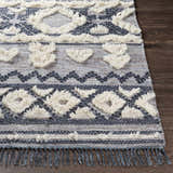 Close-up of Gakona High-Low Cream&Blue Wool Rug showing texture, fringe, and bohemian-inspired geometric pattern. Front