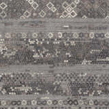 Close-up of Galchutt Embossed Gray Rug. Hand-loomed viscose and wool rug with charcoal, light gray, and diamond pattern. Swatch