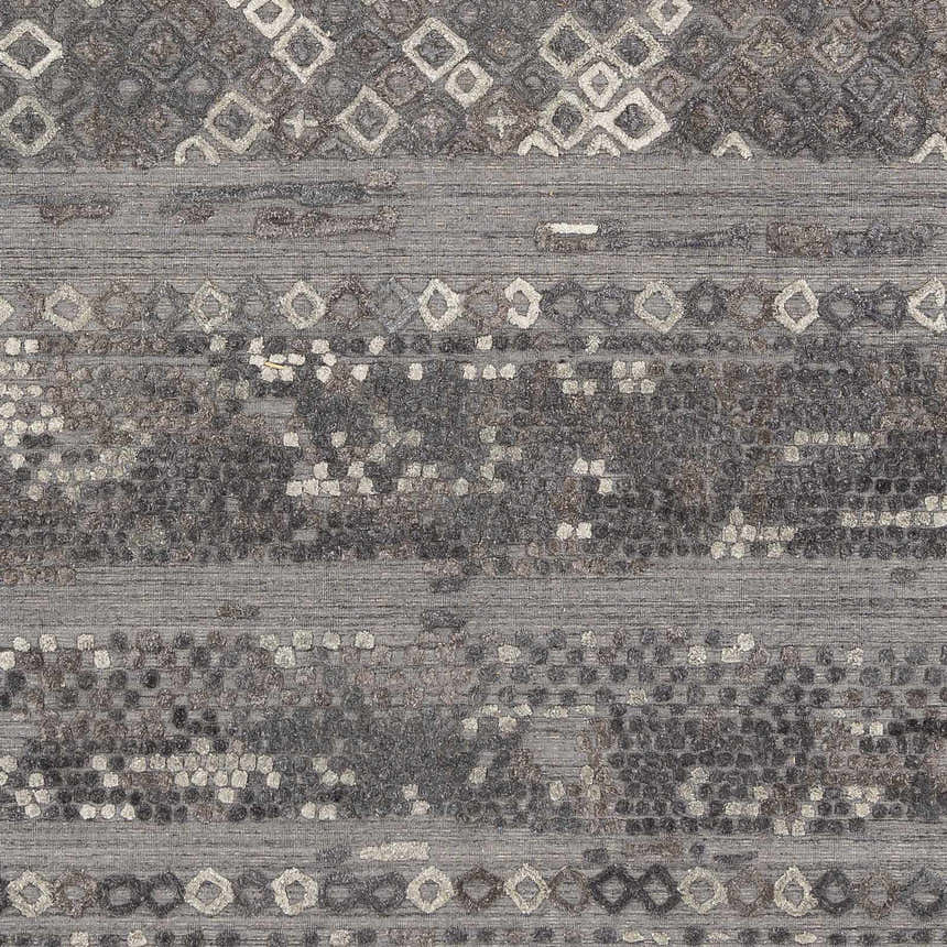 Close-up of Galchutt Embossed Gray Rug. Hand-loomed viscose and wool rug with charcoal, light gray, and diamond pattern. Swatch