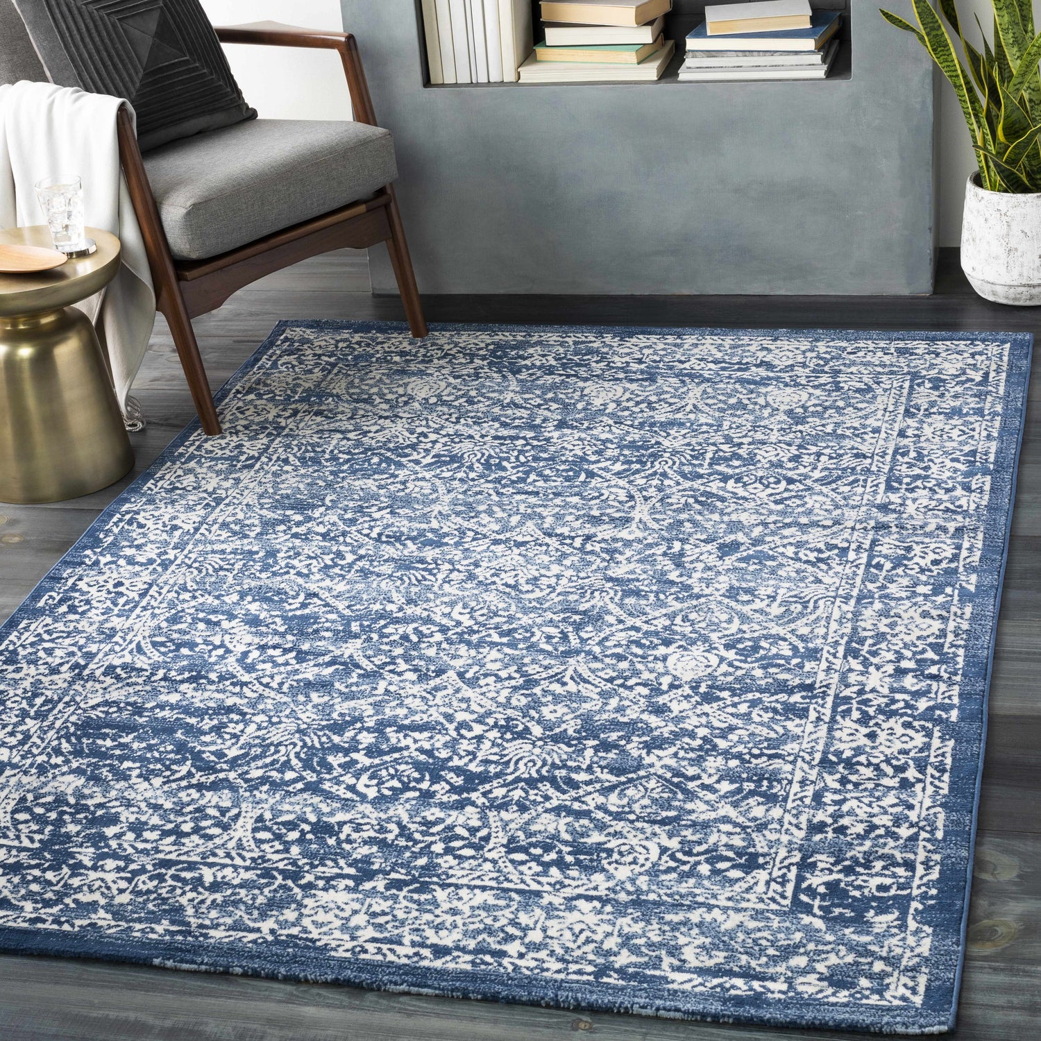 Living room scene with a blue and cream Galloway Area Rug, chair, and side table. Roomscene-Rectangle