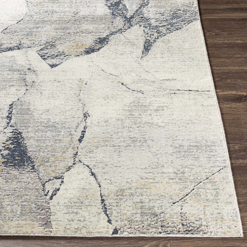 Close up of the Gasquet Gray Marble Textured Luxe Rug showing its charcoal, gray, and yellow pattern. Front