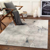 Living room scene with Gasquet Gray Marble Textured Luxe Rug, chair, and side table. Roomscene-Rectangle