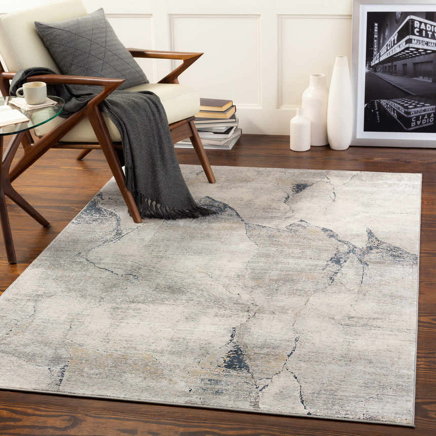 Living room scene with Gasquet Gray Marble Textured Luxe Rug, chair, and side table. Roomscene-Rectangle