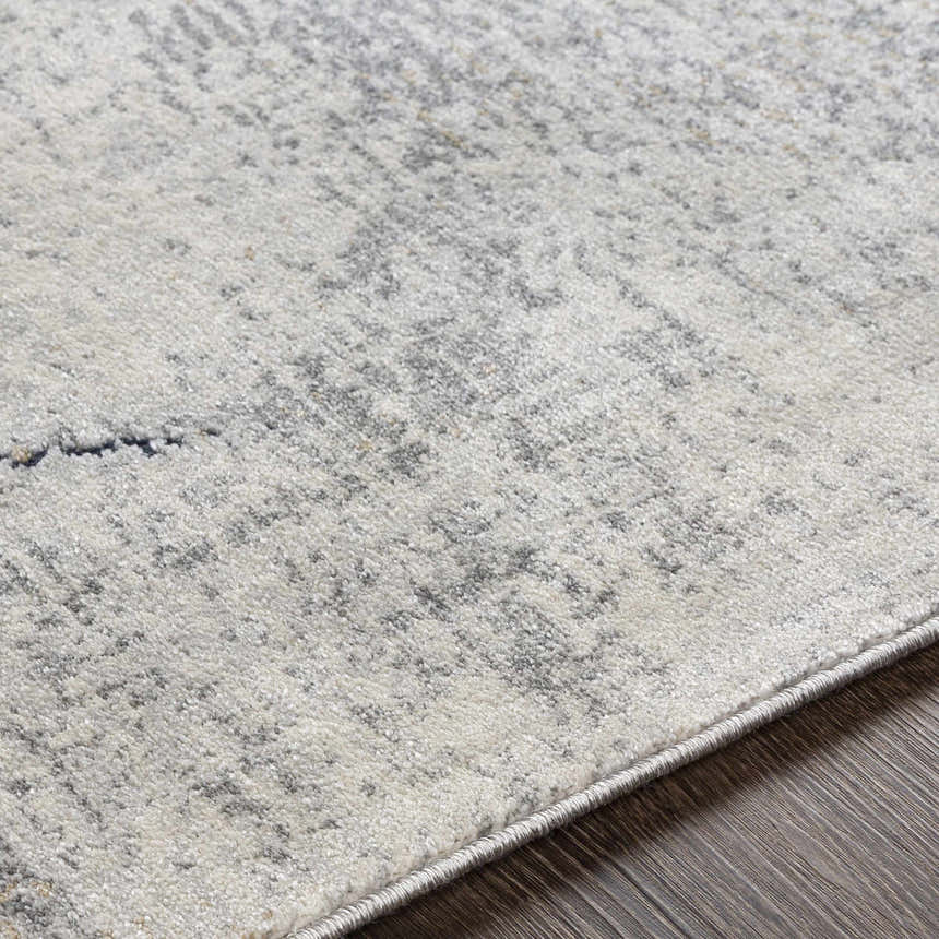 Close-up of the Gasquet Gray Marble Textured Luxe Rug, showing charcoal, light gray, and subtle marble pattern. Texture