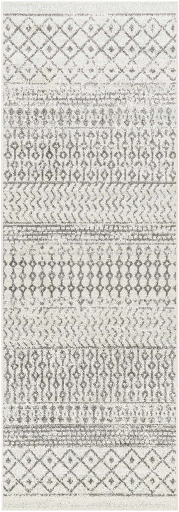 Close-up of the Genji Area Rug, a machine-woven rug with gray geometric patterns on a light gray, textured background. Design-Runner-2776