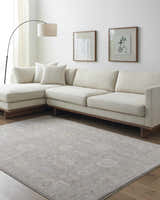 Living room scene with a Giang Thick Luxe Area Rug in gray, beige sofa, and modern decor. Roomscene-Rectangle