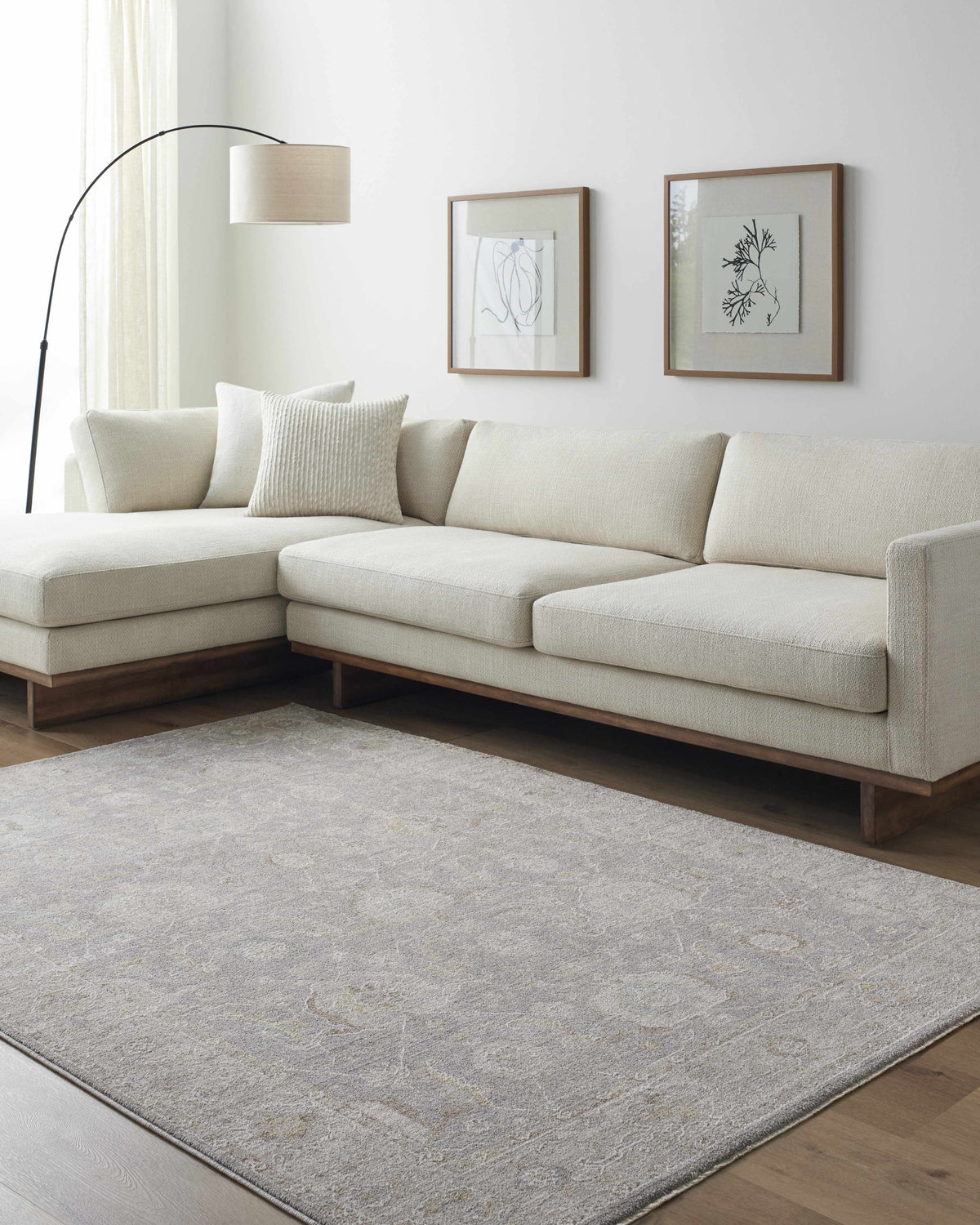 Living room scene with a Giang Thick Luxe Area Rug in gray, beige sofa, and modern decor. Roomscene-Rectangle