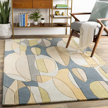 Living room scene with a Grampian Area Rug in olive, sage, slate blue, tan, and teal with a contemporary geometric design. Roomscene-Rectangle