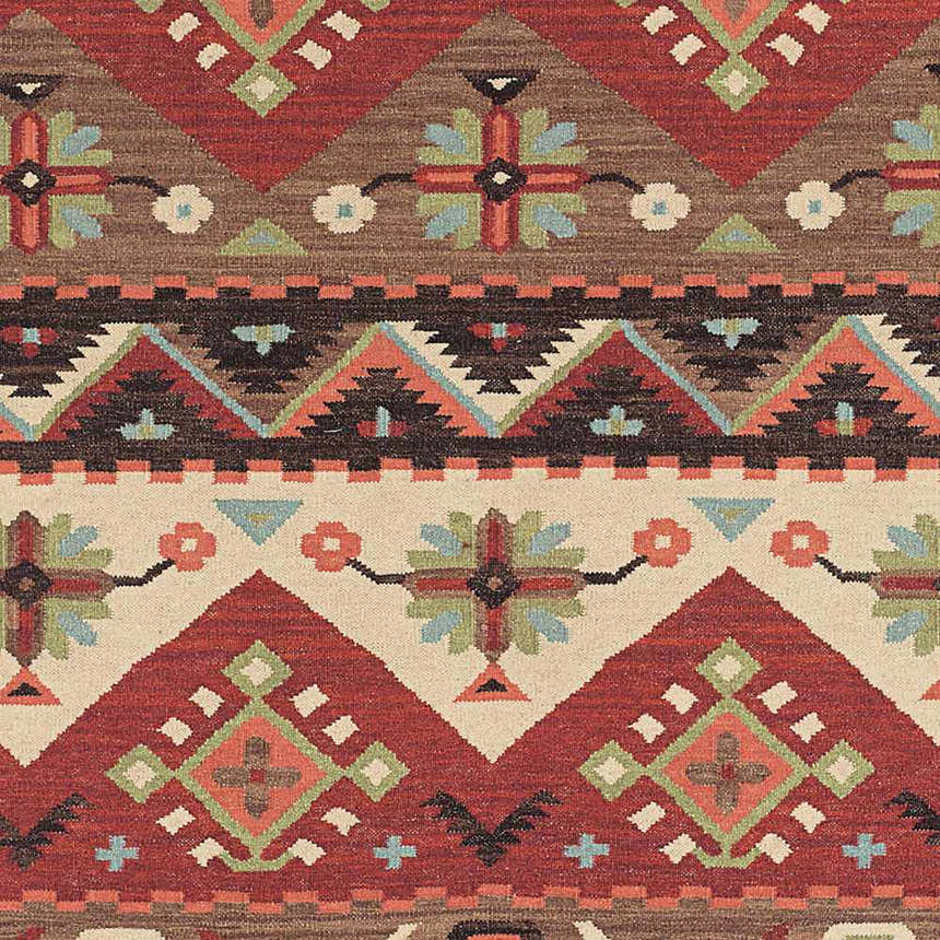 Close-up of the Grimsby Wool Area Rug showing its burgundy, brown, gray, and peach Southwestern-inspired geometric pattern. Swatch