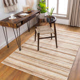 Home office with wood desk, woven chair, and Greenbackvile Area Rug in cream, beige, and brown stripes. Roomscene-Rectangle