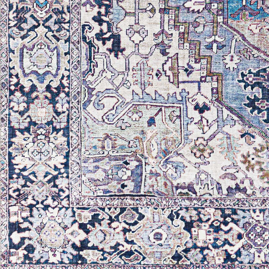 Close up of the Neyland Iris Blue Area Rug, showcasing its cream, blue, and mauve traditional pattern. Swatch