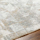 Close-up of the Halia Thick Luxe Boutique Rug, showcasing its cloud gray, dark brown, and light gray contemporary design. Texture