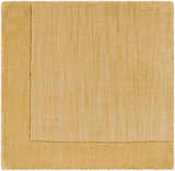 Close-up of a hand-loomed Bordered Solid Camel Yellow Wool Rug showing its texture and simple, contemporary design. Swatch