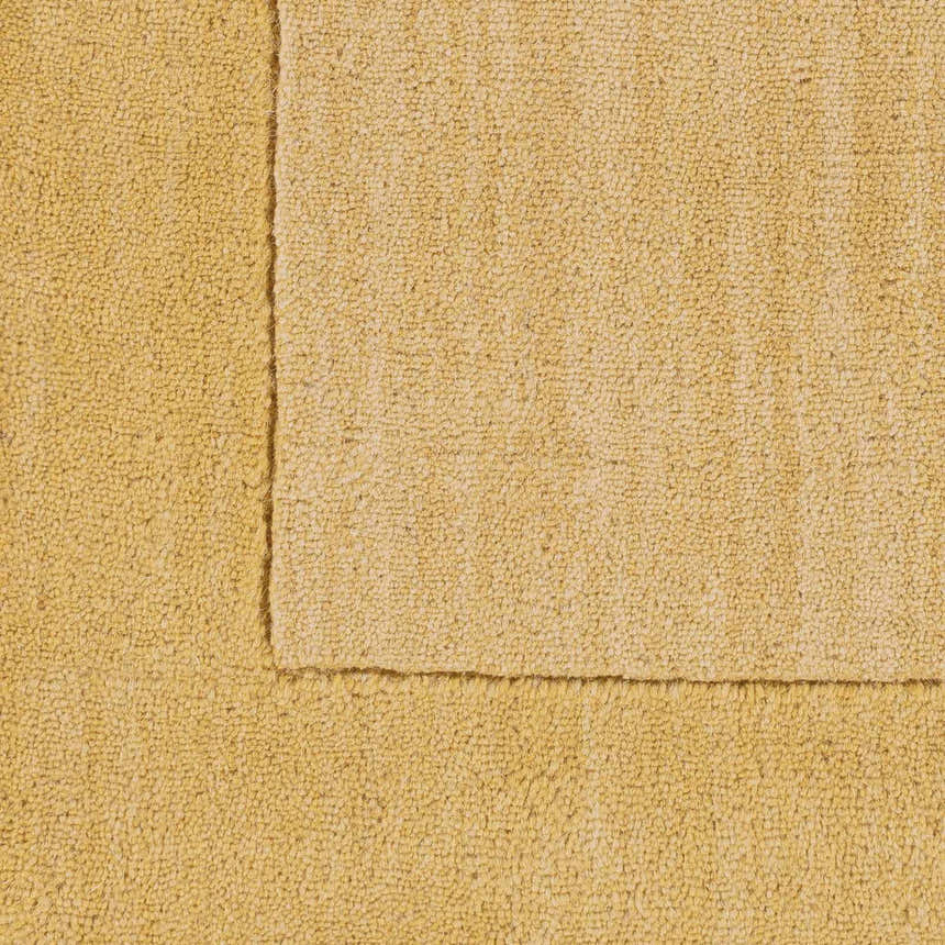 Close-up of a Bordered Solid Camel Yellow Wool Rug showing texture and border detail. Swatch