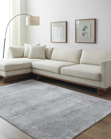 Living room scene with a neutral sectional sofa and gray Hanne Thick Luxe Rug. Roomscene-Rectangle