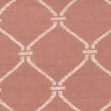 Close-up of Hazelhurst Area Carpet showing dusty pink wool with a light gray geometric trellis pattern. Swatch