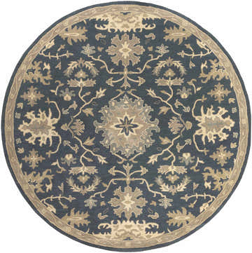 Close-up of the round Caesar 1154 Navy Wool Rug featuring a floral, bohemian pattern in navy, beige, and gray. Design-Round-8