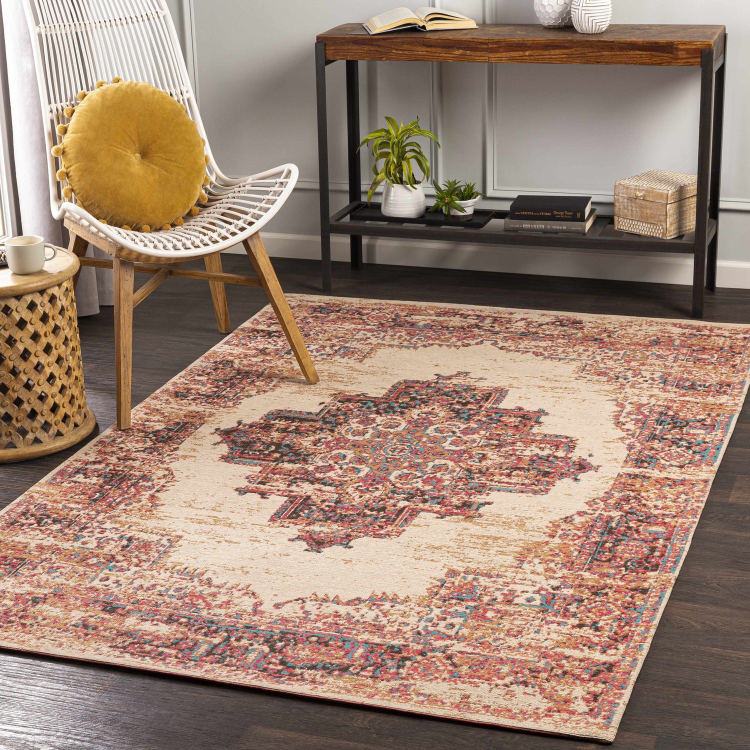 Living room scene with a Heaton Red Medallion Area Rug, white chair, wood table, and dark wood floors. Roomscene-Rectangle