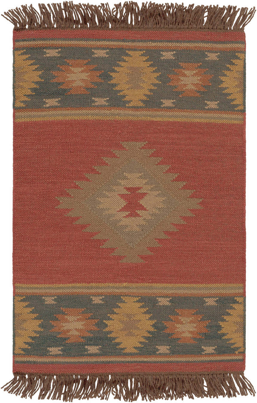 Close-up of the Hedon Wool Area Rug. Brick red rug with a Southwestern-inspired geometric pattern and brown fringe. Design-Rectangle-23