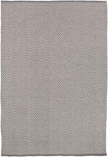 Close-up of the Herlong Charcoal Herringbone Rug. Hand-woven rug with a charcoal and light brown chevron pattern. Design-Rectangle-576