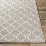 Close-up of the Hindley Area Rug, a hand-woven rug with a cream diamond pattern on a gray wool and viscose blend. Front