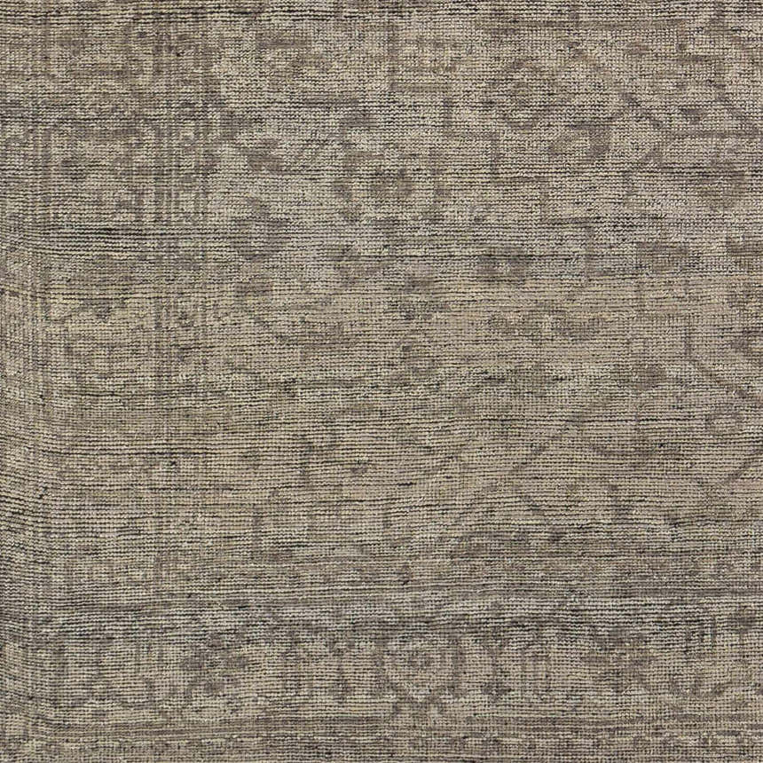 Close-up of the hand-knotted Hollym Premium Rug. Beige, black, and charcoal wool with a traditional Oriental pattern. Swatch