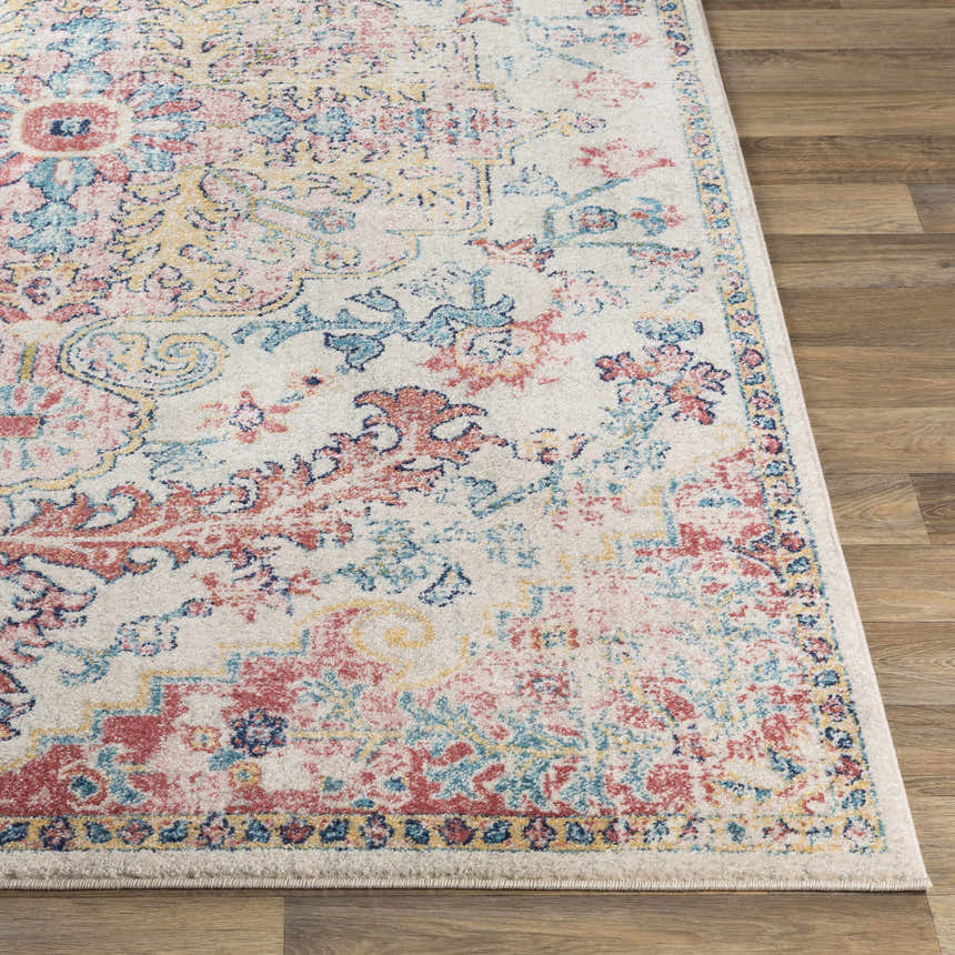 Close-up of the Hemingbrough Red&White Medallion Rug showing its red, blue, and saffron bohemian design on an off-white base. Front