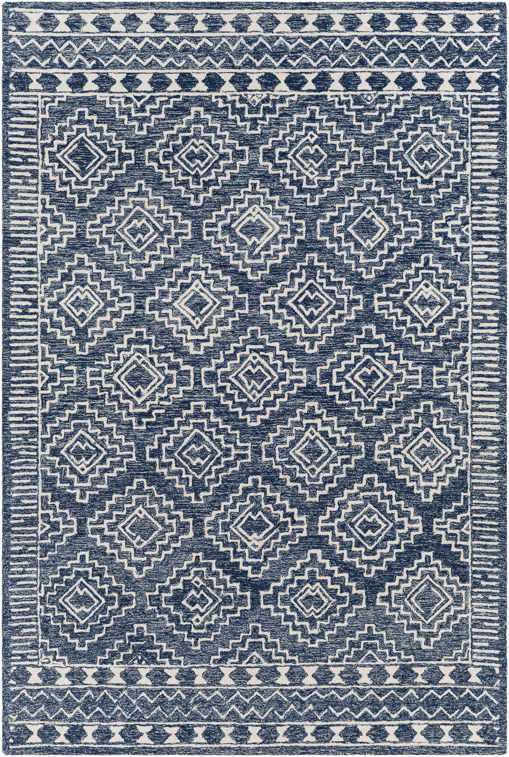 Close-up of the Horton Modern Wool Rug. Hand-tufted rug with a geometric pattern in navy and beige. Bohemian style. Design-Rectangle-69