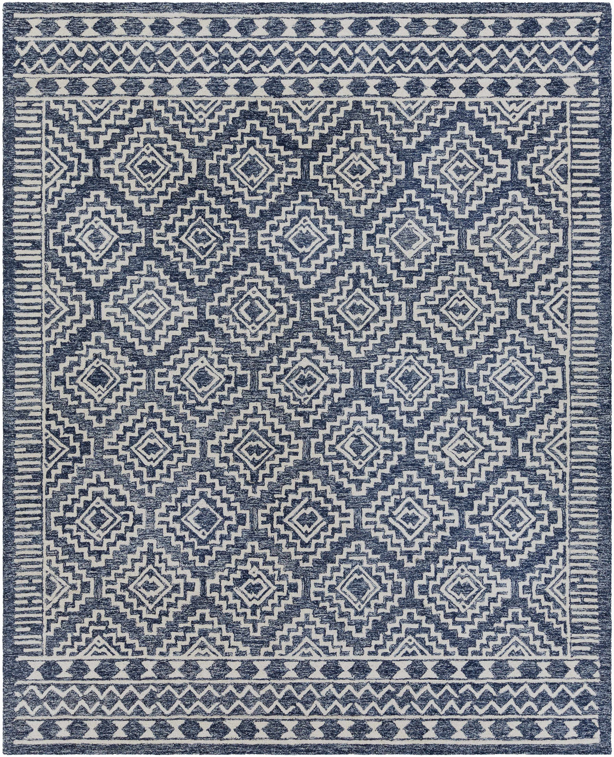 Close-up of the Horton Modern Wool Rug, featuring a geometric diamond pattern in navy and beige. Hand-tufted texture. Design-Rectangle-810