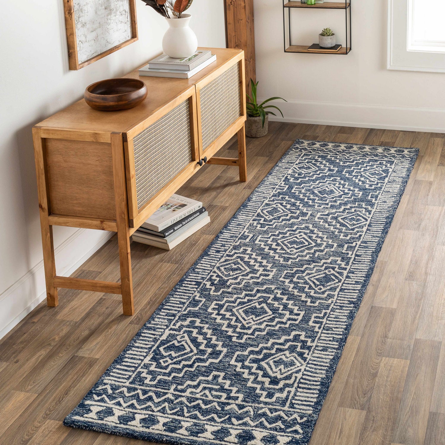 Entryway with a blue and beige Horton Modern Wool Rug runner, wood floors, and a light wood console table. Roomscene-Runner
