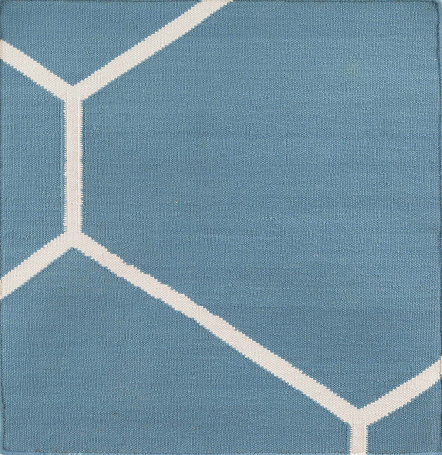 Close-up of the Hoskins Area Carpet. Hand woven cotton rug in denim blue with an off white geometric pattern. Swatch