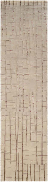 Close-up of the Hotchkiss Area Carpet. Hand-knotted wool rug with a brick red, light brown, and mustard abstract tree design. Design-Runner-2610