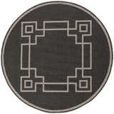 Close-up of a round Harborcreek Area Rug. Black rug with a light beige geometric Greek key pattern and border. Design-Round-73