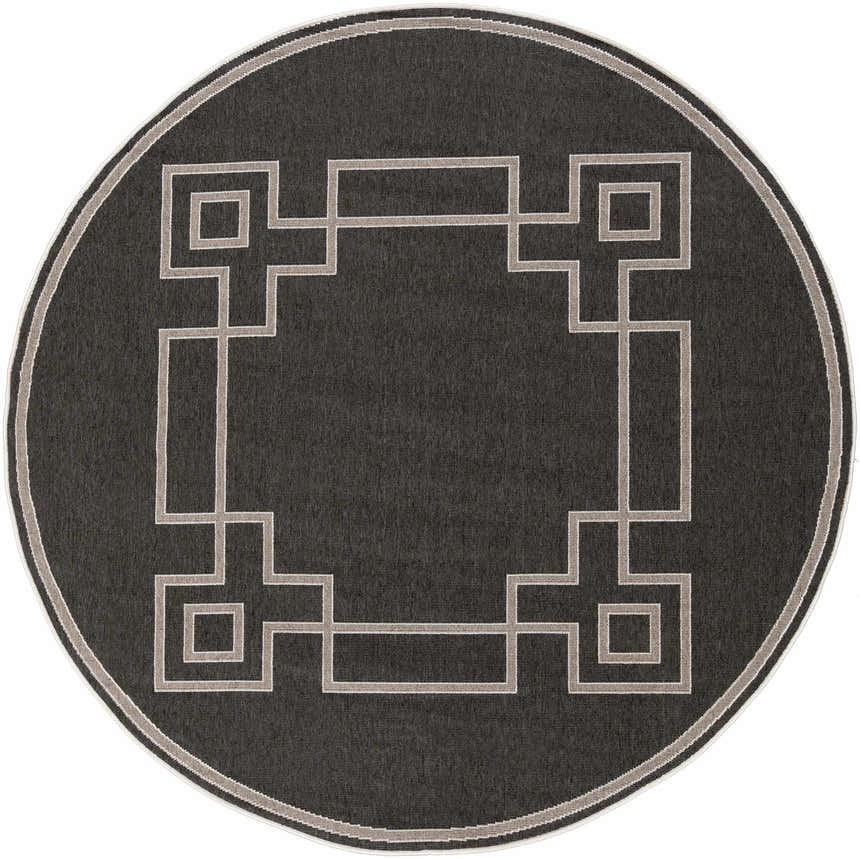 Close-up of a round Harborcreek Area Rug. Black rug with a light beige geometric Greek key pattern and border. Design-Round-73