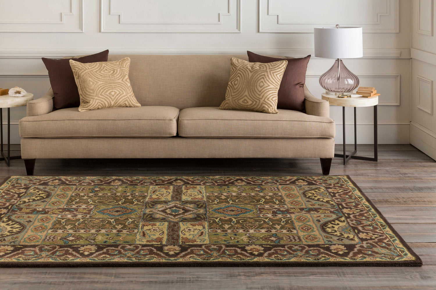 Living room scene with a beige sofa and the Huguenot 12x15 wool rug in beige, brown, olive, and teal colors. Roomscene-Rectangle