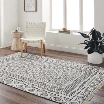 Farmhouse-style room with a Hulda Area Rug in dark brown and gray, woven wool, and geometric patterns. Roomscene-Rectangle