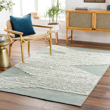 Living room scene with Igcocolo Sage Green High-Low Wool Carpet, wood floors, chair, and cabinet. Modern bohemian style. Roomscene-Rectangle