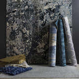 Rolled Ingomar Area Rugs in black, denim, sage, gray, and off white. Contemporary hand-knotted viscose rugs. Styleshot