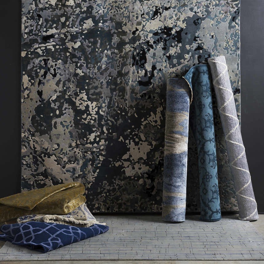 Rolled Ingomar Area Rugs in black, denim, sage, gray, and off white. Contemporary hand-knotted viscose rugs. Styleshot