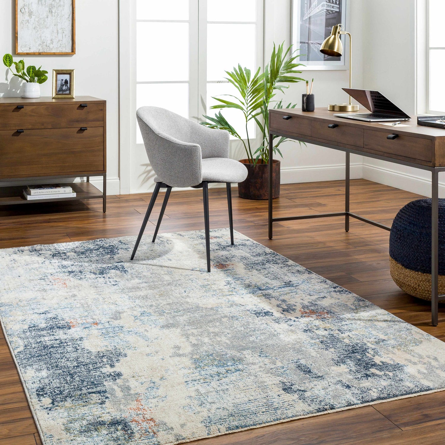 Home office with wood desk, gray chair, and Iryna Area Rug in charcoal, brown, gray, and nutmeg. Contemporary style. Roomscene-Rectangle