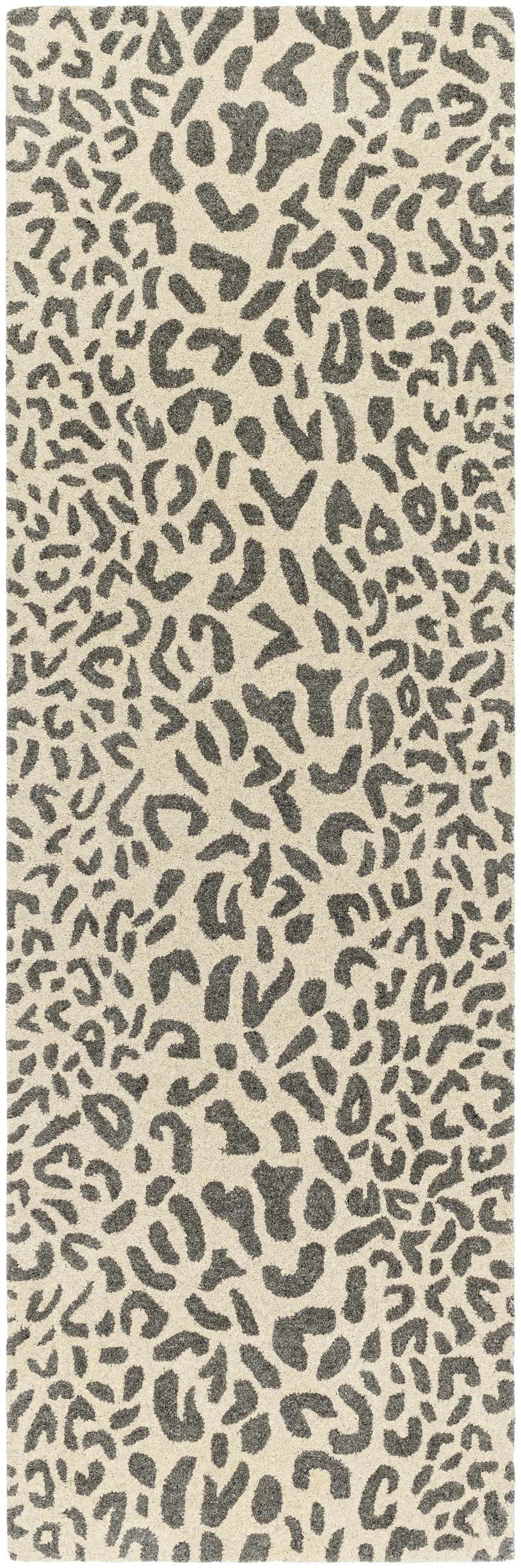 Close-up of the Iseul Leopard Print Area Rug, a hand-tufted wool rug with a dark gray animal print on a light beige background. Design-Runner-268