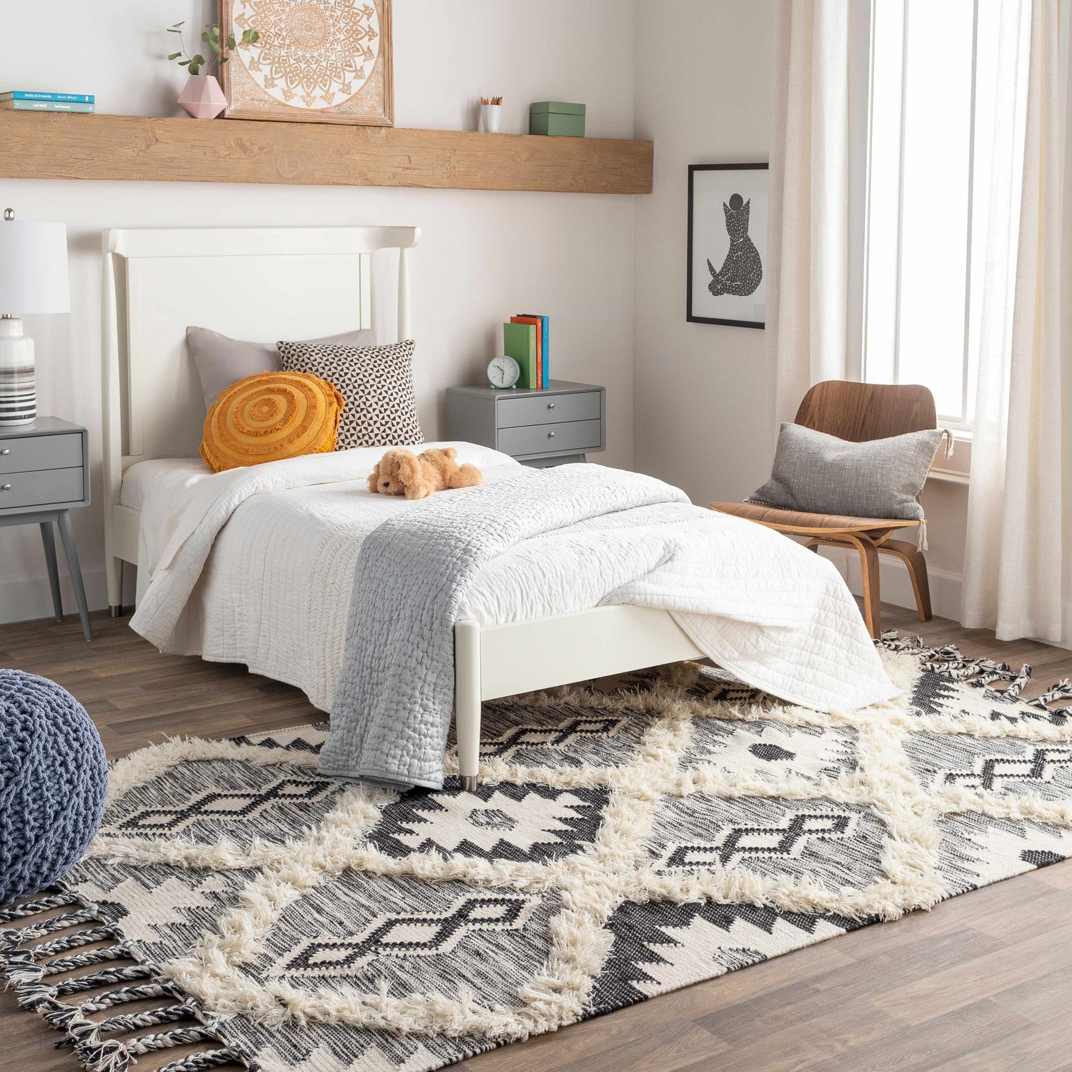 Kids bedroom with Jarales Cream/Black Tribal Tassel Wool Rug, white bed, gray nightstand, and wood accents. Roomscene-Rectangle