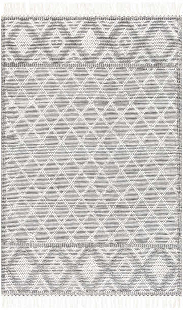 Close-up of the hand woven Jaya Area Rug. Features a gray and white diamond pattern and fringe. Design-Rectangle-576