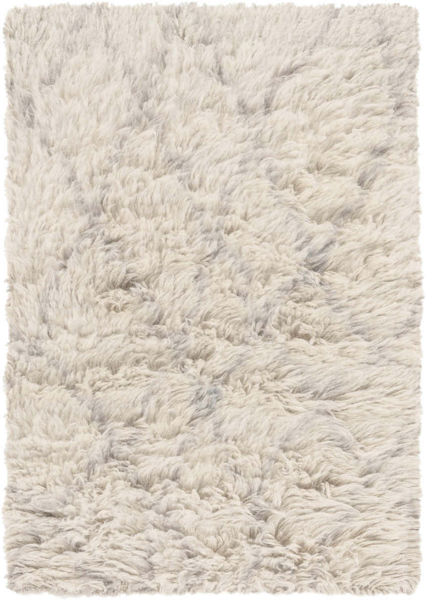 Close-up of the hand-knotted Jeddo Area Rug. The 100% wool rug has a charcoal and ivory neutral color palette. Design-Rectangle-23