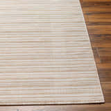 Close-up of Greg Beige Area Rug showing light brown and ivory horizontal stripes and woven texture on wood floor. Front