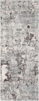 Close-up of the Johnetta Carved Statement Rug in blue, charcoal, sage, and ivory with a distressed contemporary pattern. Design-Runner-338