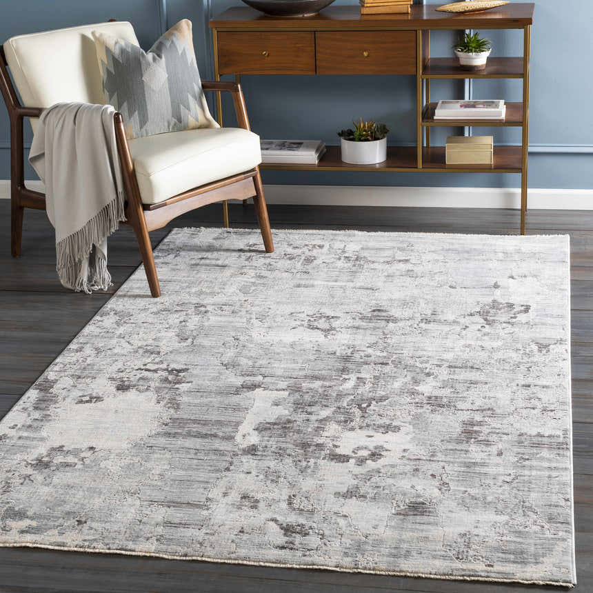 Entryway scene with Johnetta Carved Statement Rug in gray, ivory, and charcoal. Modern console table and chair. Roomscene-Rectangle