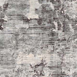 Close-up of the Johnetta Carved Statement Rug. Abstract pattern in shades of gray, charcoal, ice blue and ivory. Contemporary style. Swatch