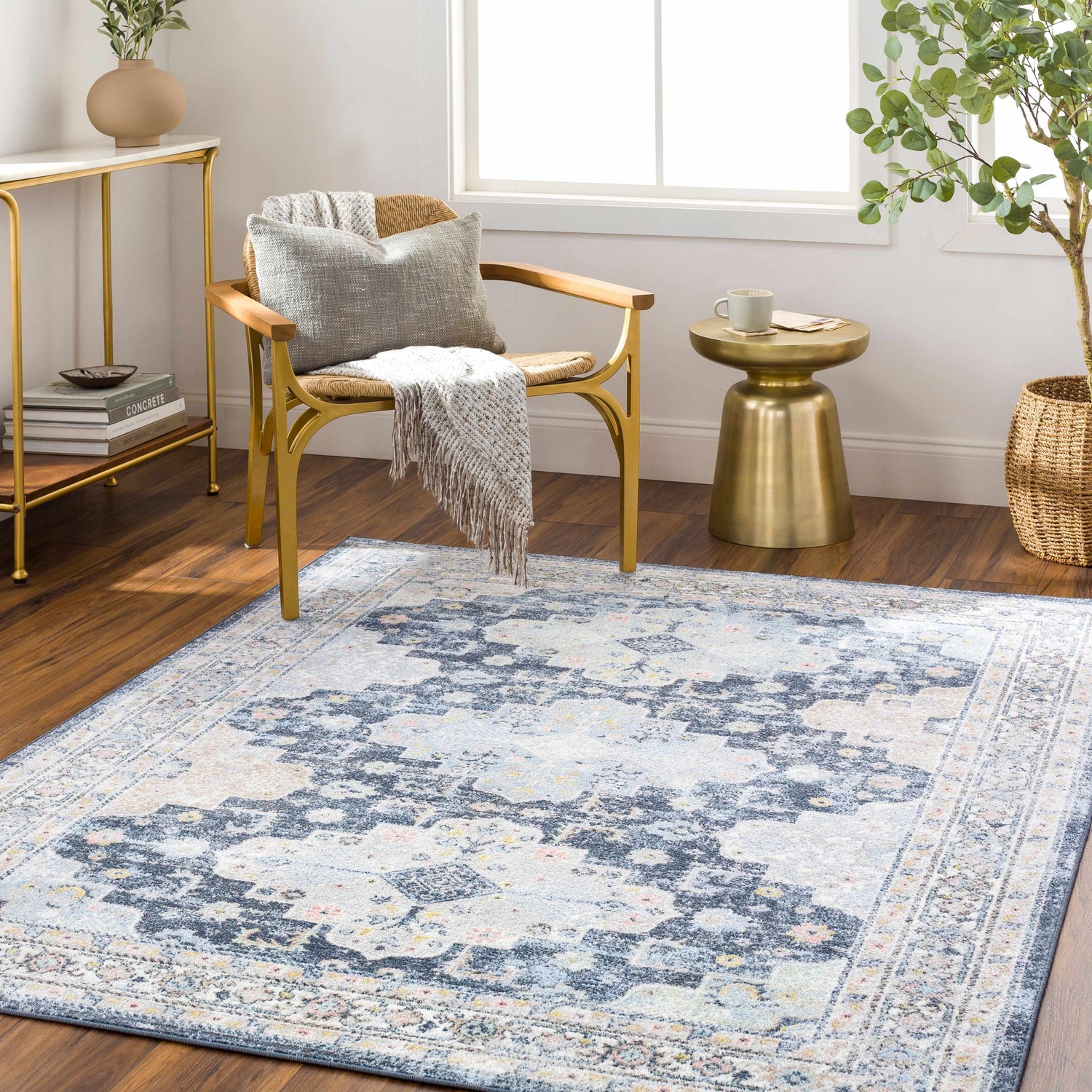 Living room scene with a Jara Washable Area Rug in dark gray and denim. Traditional rug under chair and side table. Roomscene-Rectangle
