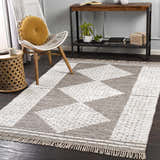 Living room scene with a brown and white Junction Carpet, white chair, and wood accents. Roomscene-Rectangle